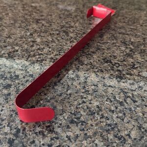 NWT. Metal wreath door hanger. New with tag, red color great for Christmas